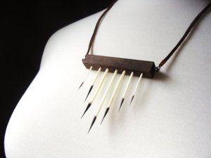 http://www.etsy.com/listing/124146999/wood-and-porcupine-quills-necklace?ref=market